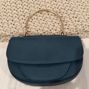 Elegant Blue Handbag with Gold Handle